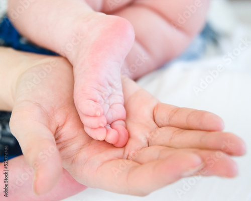 Photo: Baby feet in mothers hands Baby feet in mothers hands