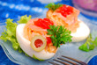 Foto: eggs with smoked salmon and red caviar eggs with smoked salmon and red caviar