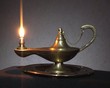 old antique magic lamp burning on the table