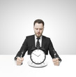 businessman eating clock