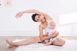 Healthy mother and baby making gymnastics