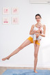 mother does gymnastics with her baby