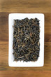 wild rice in a white bowl on wooden background