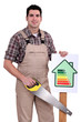 Builder holding up an energy efficiency rating sign