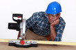 Photo: Man with a circular saw Man with a circular saw