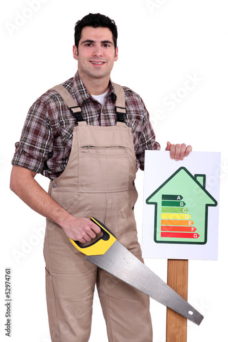 Photo: Builder holding up an energy efficiency rating sign Builder holding up an energy efficiency rating sign