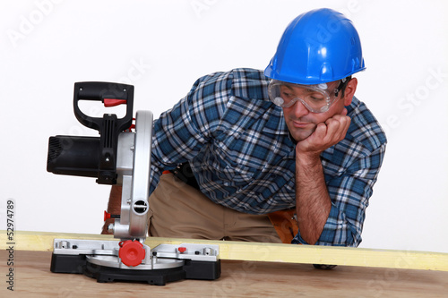 Photo: Man with a circular saw Man with a circular saw