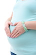 Pregnant woman making heart shape