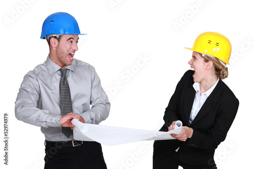 Photo: Two architects fighting over plans Two architects fighting over plans