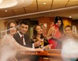 Foto: Group of young people playing poker in a casino Group of young people playing poker in a casino