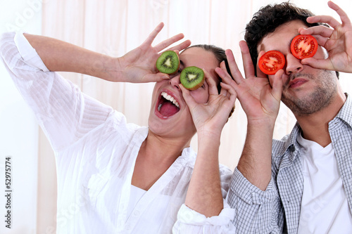 Photo: Couple messing around with fruit Couple messing around with fruit
