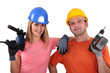 Foto: craftsman and craftswoman holding drills craftsman and craftswoman holding drills