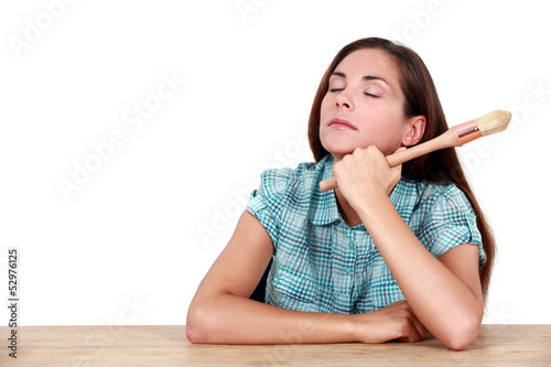 Photo: Sleepy woman holding paint brush Sleepy woman holding paint brush