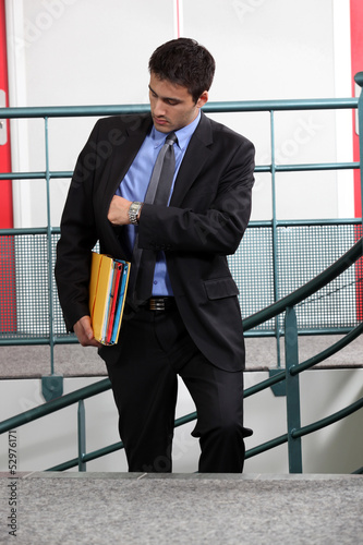 Photo: Businessman looking at the time Businessman looking at the time