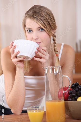 Photo: Blond woman having breakfast Blond woman having breakfast