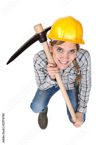 Photo: Craftswoman holding a pick Craftswoman holding a pick
