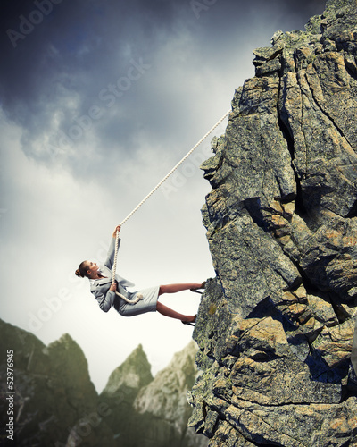Photo: businesswoman climbing mountain businesswoman climbing mountain