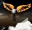 Businessman drawing wings