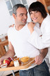 Photo: portrait of a couple at breakfast portrait of a couple at breakfast
