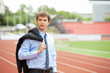 Businessman at athletic stadium and race track