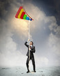 Image of businessman climbing rope