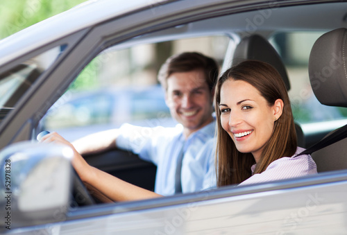 Photo: Young couple sitting in car Young couple sitting in car