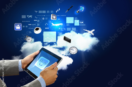 Photo: Close-up of hands holding tablet pc Close-up of hands holding tablet pc