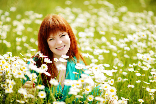 Photo: redhead young woman in the feild redhead young woman in the feild