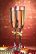 Foto: Two glasses of champagne on bright background with lights Two glasses of champagne on bright background with lights