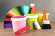 Paint pots, paintbrushes and coloured swatches