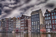 Photo: Amsterdam. Wonderful view of city canals and buildings in spring Amsterdam. Wonderful view of city canals and buildings in spring
