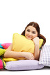 Foto: Beautiful young girl with pillows isolated on white. Beautiful young girl with pillows isolated on white.