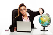 Businesswoman pointing to a world globe