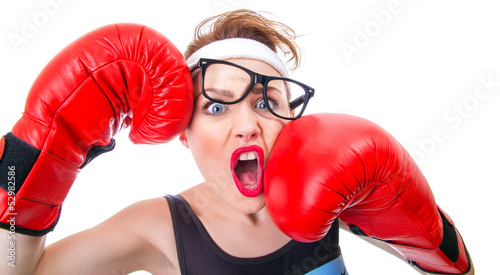 Photo: Funny fitness woman with boxing gloves Funny fitness woman with boxing gloves