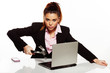 Businesswoman fixing her laptop with a hammer