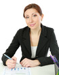 A woman at the desk writting on a paper, isolated on white