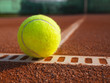 Yellow ball on the court ground