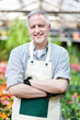 Mature gardener in a greenhouse