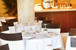 Photo: Tables set for meal Tables set for meal