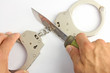knife cuts the chain of the handcuffs