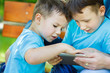Little boys playing on tablet