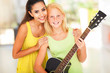 preteen girl with her music teacher