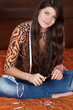 beautiful girl makes jewelry