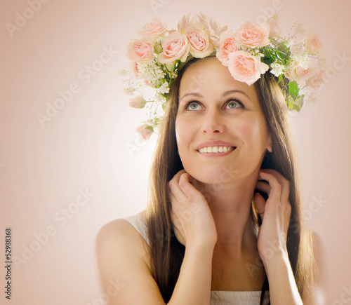 Photo: Beautiful woman with flowers in their hair Beautiful woman with flowers in their hair