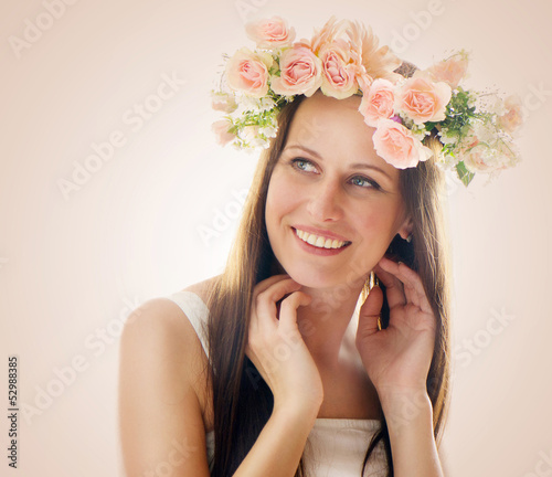 Photo: Beautiful woman with flowers in their hair Beautiful woman with flowers in their hair