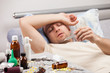 Photo: Unwell man patient lying down bed Unwell man patient lying down bed