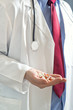 Doctor holding pills
