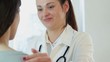 Young smiling female doctor comfort patient