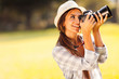 young female photographer taking pictures