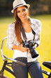 pretty woman with camera outdoors